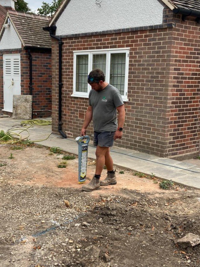 Chris Looking for Cables doing ground works landscaping in garden