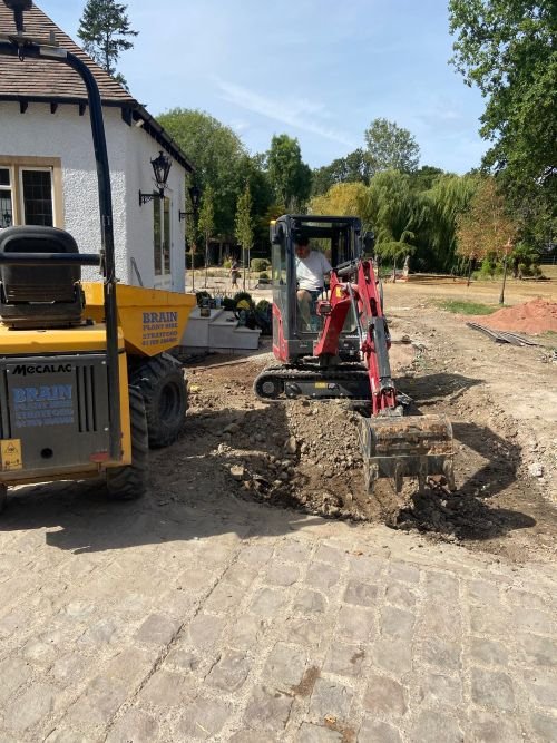 Digging out ramp in garden - hard landscaping with digger and dumper - ground works