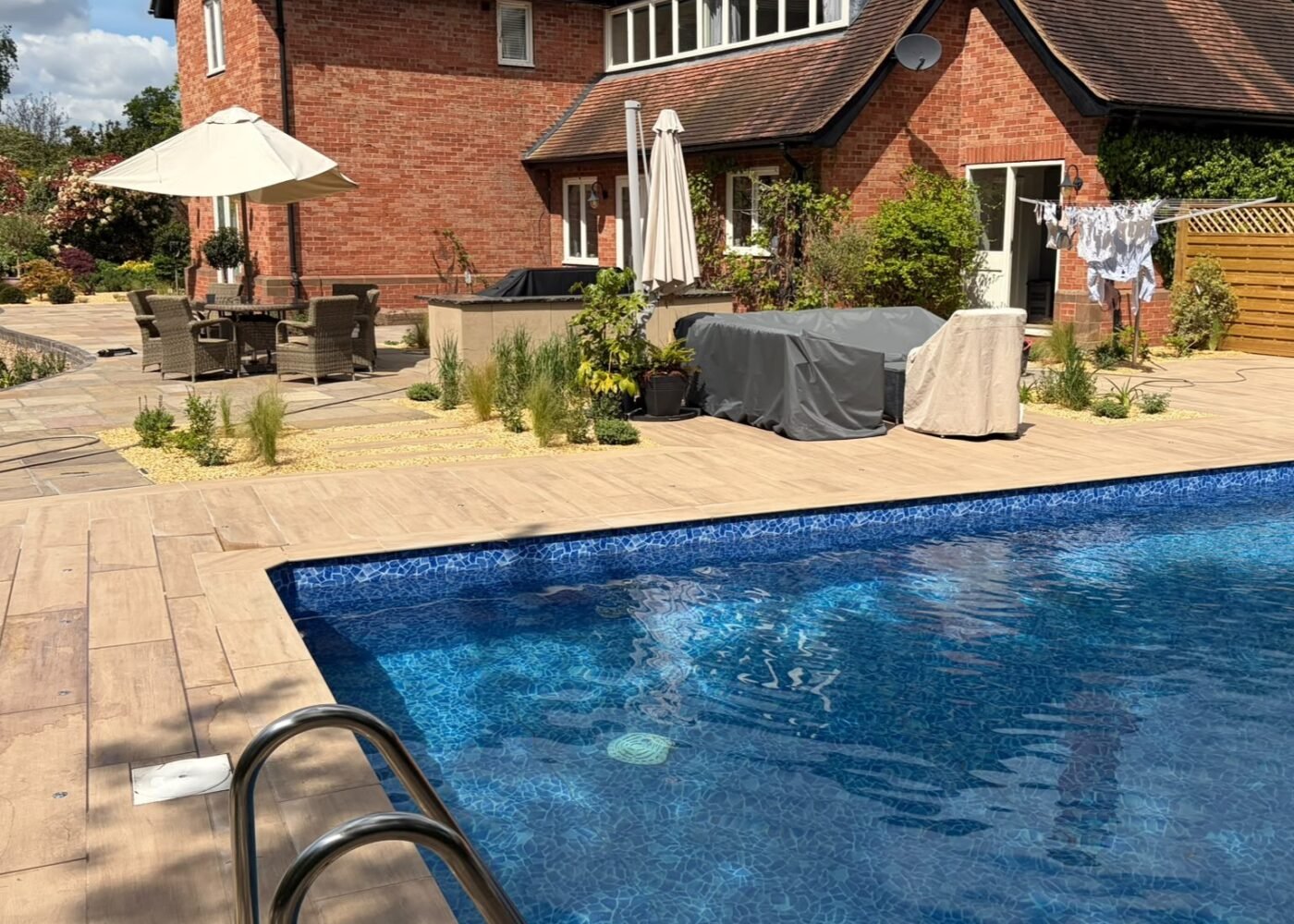 Landscaping Project, Patio, Fence, Pool, Slabbing, Porcelain patio, planting plants, planting, bbq area