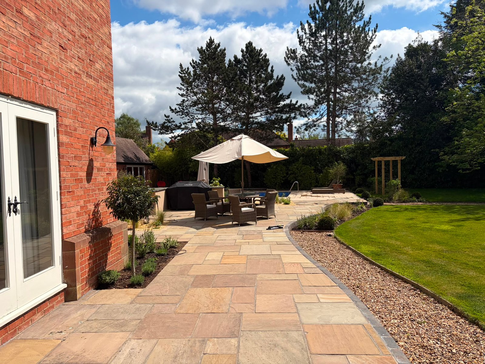 garden re-design where we replaced fencing, made a gate, built a pool, porcelain patio, slabbed patio, planting trees and 200+ other plants, path creation, bbq area created, slopes re-graded and seeded, birch tress planted, custom garden lighting